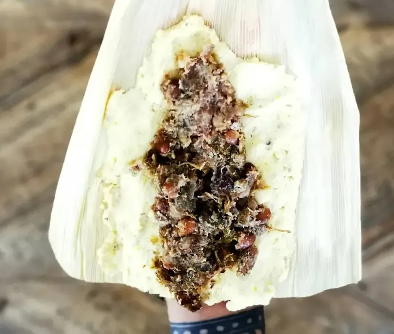 Tamale wrapped in corn husk